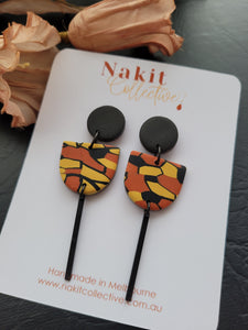 Black, mustard and terracotta tribal half circle dangle earrings