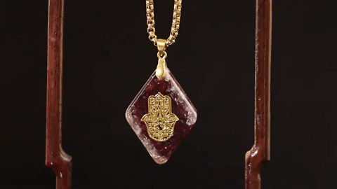 Hand of Fatima pendant crafted using garnet gemstones. Hand Of Fatima Pendant Benefits: Wards Of Evil, Brings good luck, Helps ignite love and passion, Heightens creativity and inspiration, Improves one's daily energy levels, Establishes faith and trust, Builds self-esteem, Promotes joy