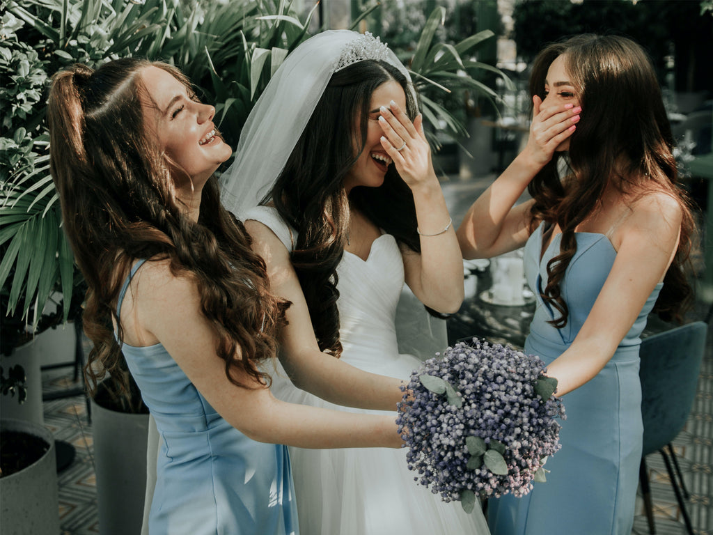 Bride and Her Bridesmaids: A heartwarming moment captured as the bride shares a joyful time with her closest friends before the wedding.