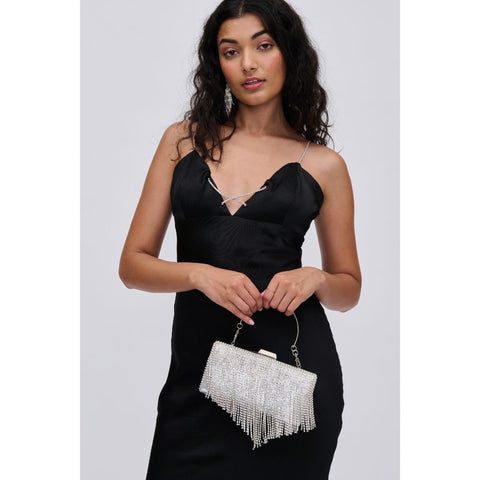 Woman in black dress  with a silver sequin fringe purse, a great Christmas gift idea for women.