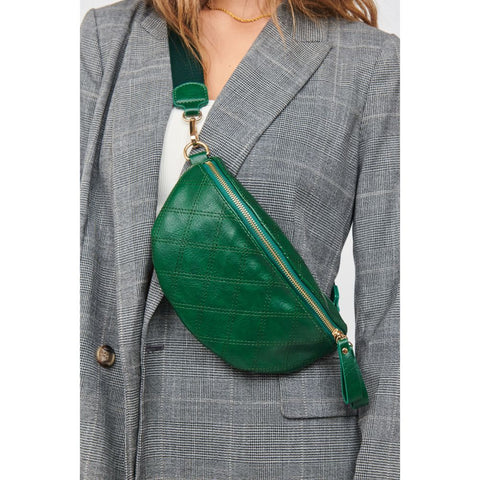 Women wearing a quilted, green business purse.