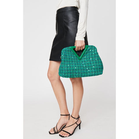 Women holds a green, tweed print Valentine’s purse