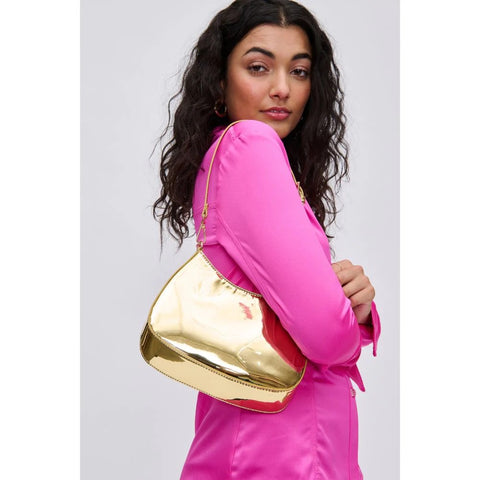 A woman with mirror finish gold bag
