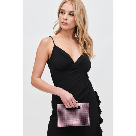 A woman holds pink rhinestone purse