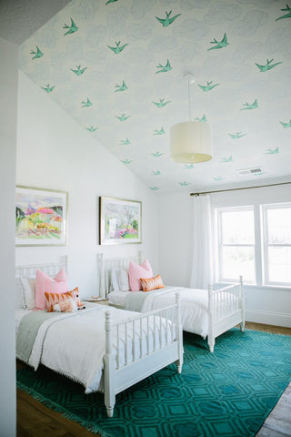 swallow wallpaper on a kids bedroom ceiling