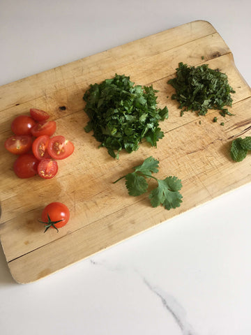 chopped tomato, parsley and cilantro 