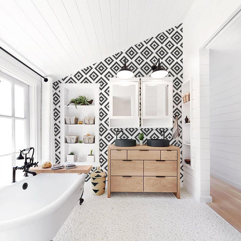 white bathroom with black and white geometric wallpaper