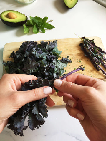 ripping kale from the stem