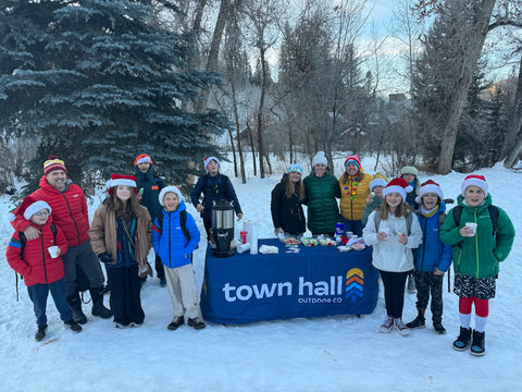 Kids getting cocoa on their way to school with Town Hall