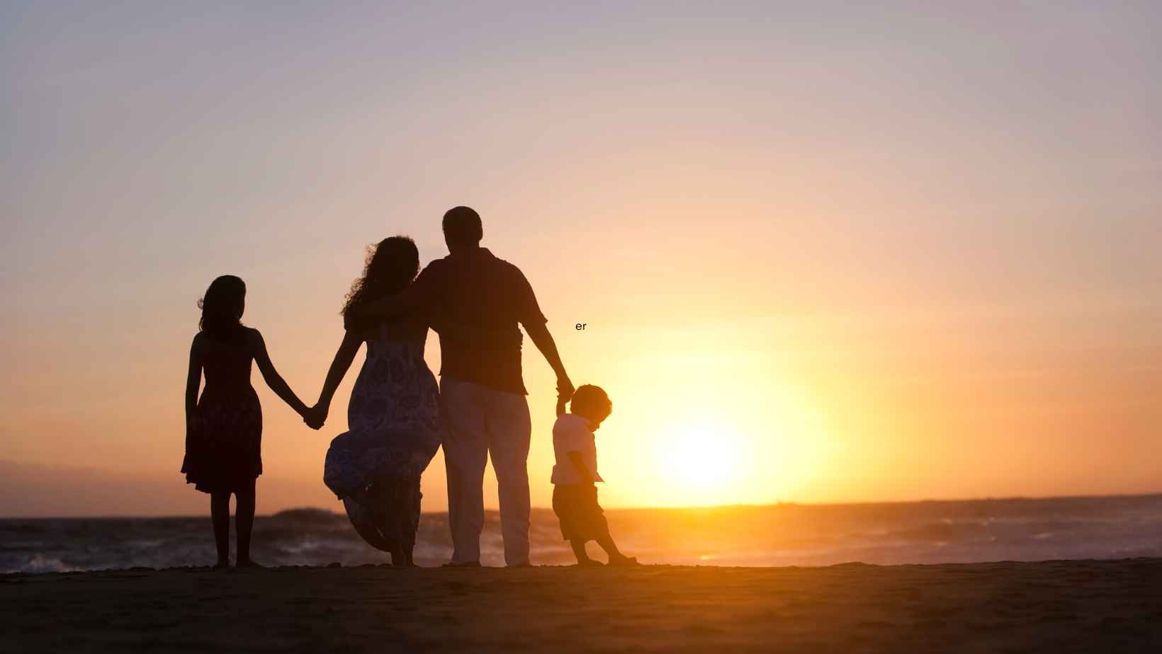 Family outing at the beach during sunset