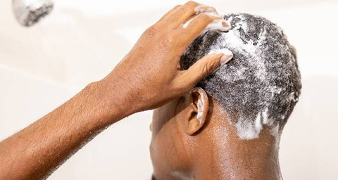 black man washing his hair