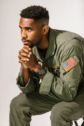 black man with drop fade sitting on stool