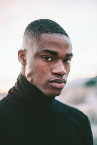 black man with high fade and turtleneck