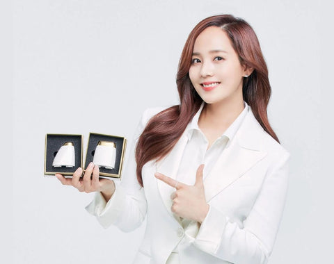 Actress Eugene holding the Dualsonic Professional HIFU device’s dual cartridges - Dualsonic Professional review - BeautyFoo Mall
