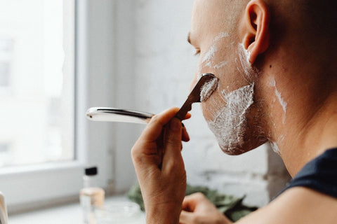 Unknown man shaving his face - Best Men Skin Care Malaysia Routine - beautyfoomall.com