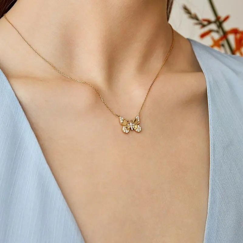 https://cdn.shopify.com/s/files/1/0512/4394/2051/products/MONET-GARDEN-COLLECTION-18K-Gold-Butterfly-Diamond-Necklace-BUNNY-COLLECTION-1679037920.jpg?v=1704264087&width=1000