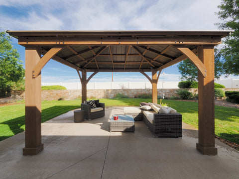 outdoor pergola on patio with furniture, real estate photography