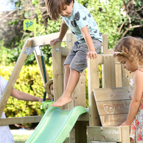 Child climbing on wooden climbing frame