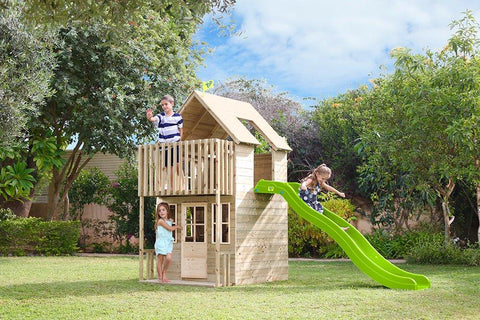 Children playing in a two storey wooden playhouse