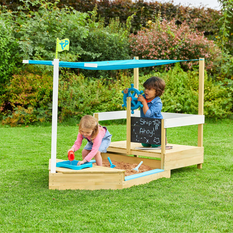 Children playing on Ahoy wooden playboat