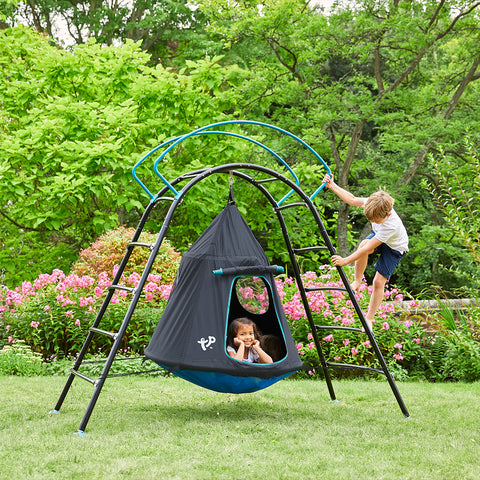 Two children climbing in a ufo themed climbing den