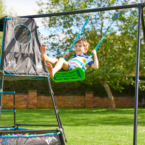 Child playing on metal climbing frame swing arm accessory