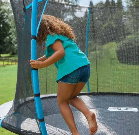 Child entering through a trampoline enclosure