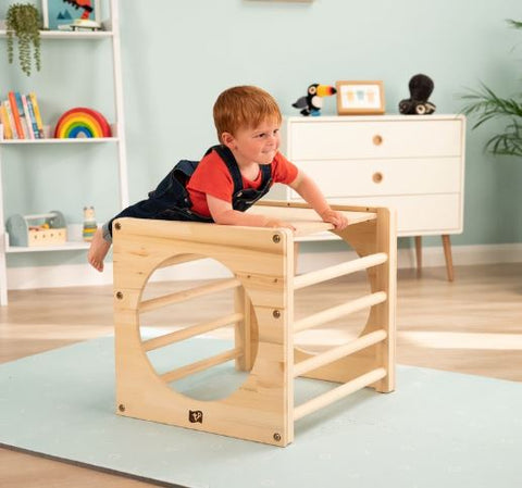 Child climbing on active tots cube