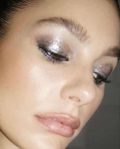 Reflective metallic eyeshadows added futuristic dimension and shimmering allure to lids