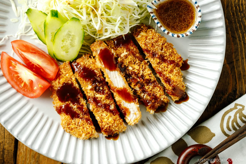 Tonkatsu is a classic Japanese dish featuring deep-fried pork cutlets coated in panko breadcrumbs