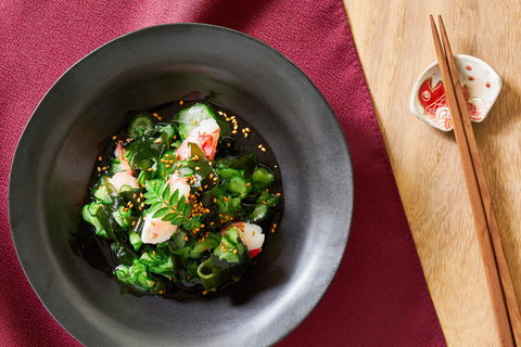 Tangy vinegared salad with sliced cucumbers and seaweed