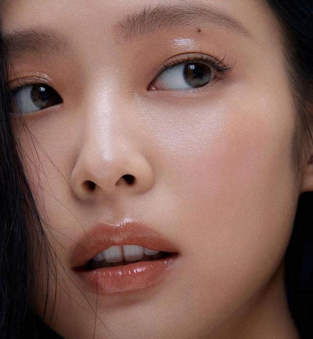 Achieving glossy light-tinted lips completes your clean makeup look
