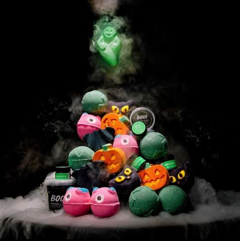 Halloween-themed bath bombs with eerie colors and scents, such as "blood" red or "witch's brew" green.