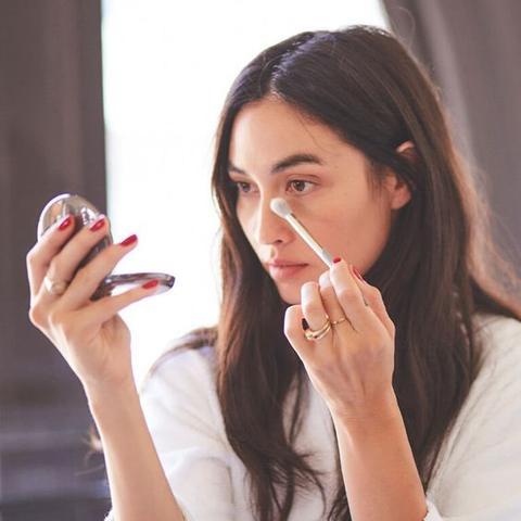 Keep a compact with a mirror, brush, or sponge for midday touch-ups to maintain a fresh look without over-powdering