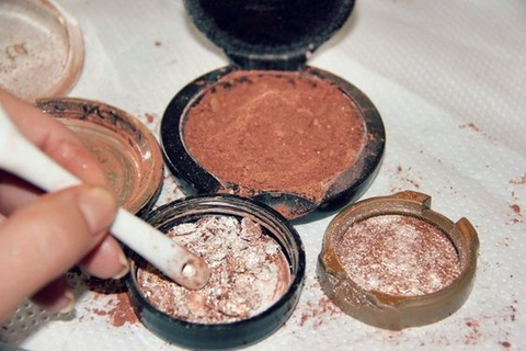 Break the compact powder into fine pieces, ensuring no large chunks remain. Create an even consistency