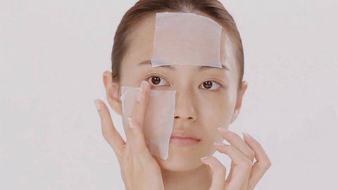 Using a cotton pad to apply Japanese toner or lotion