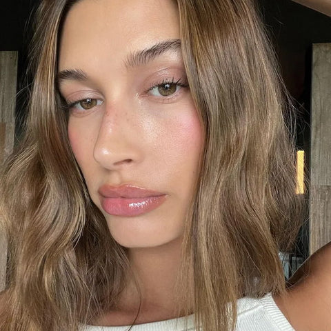 Hailey Bieber is often seen with a touch of blush with mascara for her clean makeup look