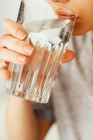 Stay hydrated from within by drinking abundant water.