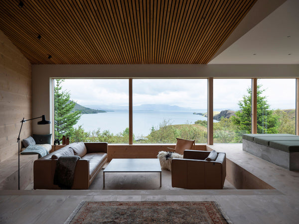 Interior shot of living room with view over landscape 