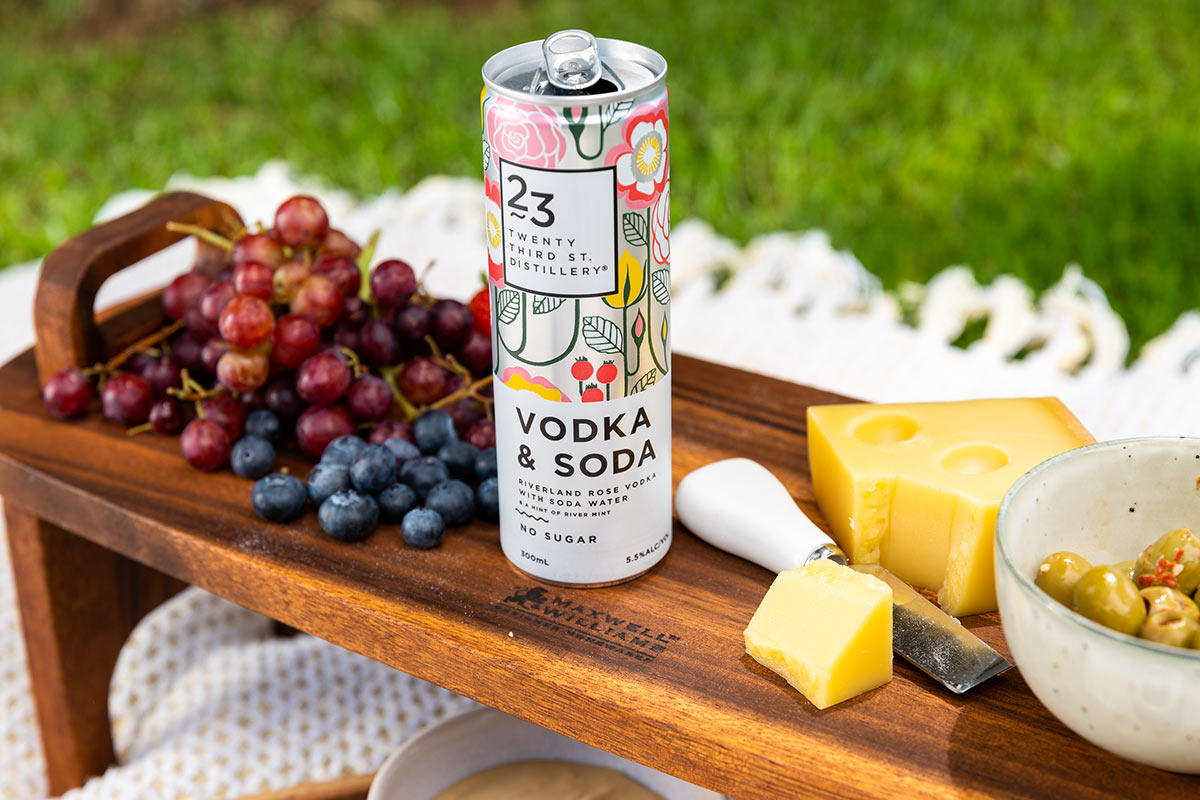23rd street vodka soda on a cheese board with grapes