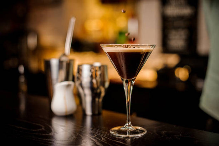 espresso martini cocktail on a table in a room