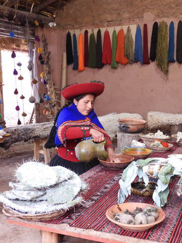 Inca woman dyes the wool