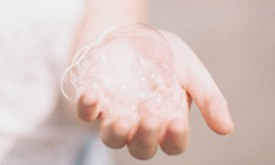 Hand of a woman with cleansing foam