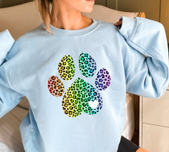 Rainbow leopard print paw on blue sweatshirt
