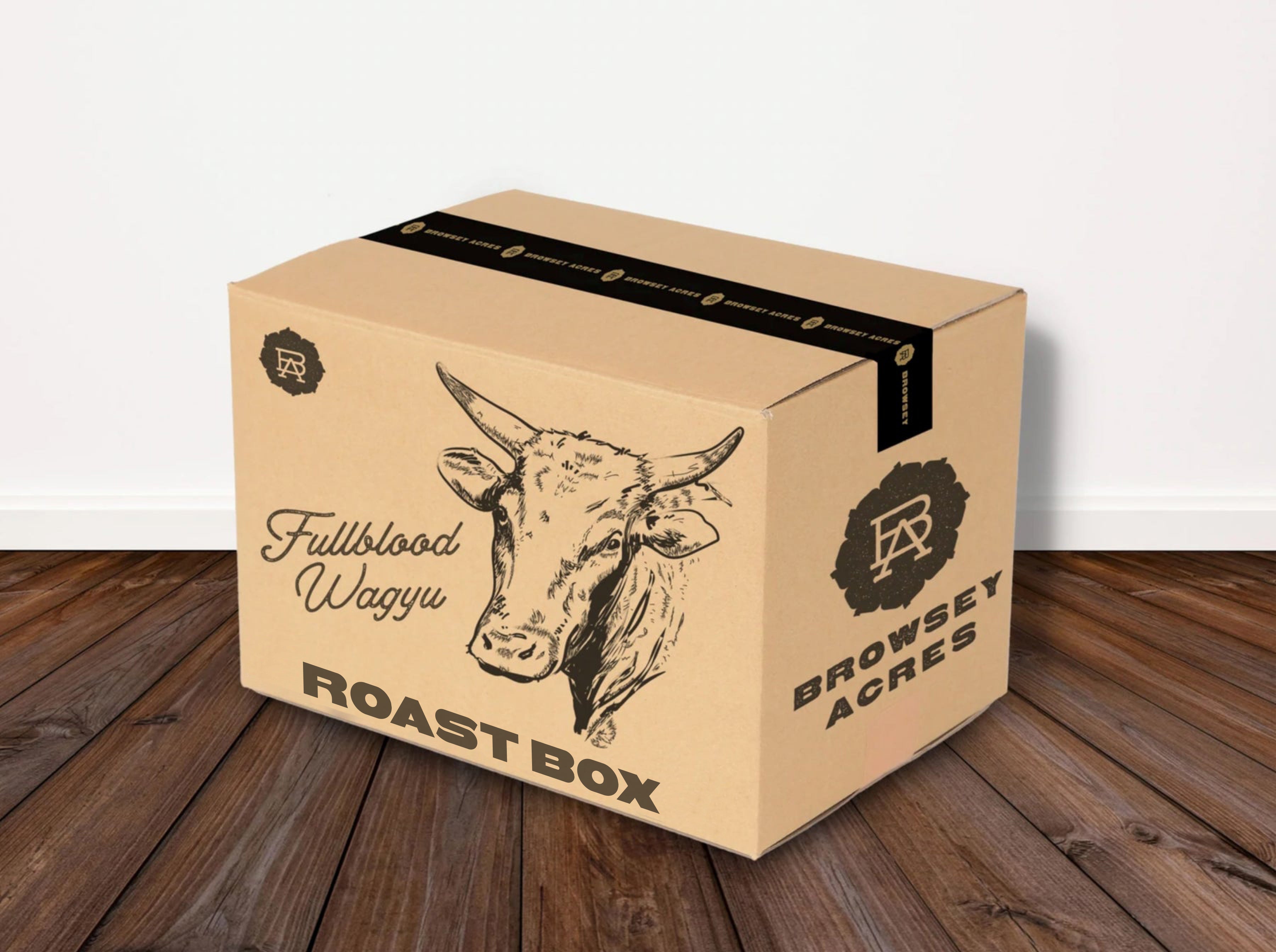 A cardboard box with 'Fullblood Wagyu Roast Box' branding on a wooden floor.