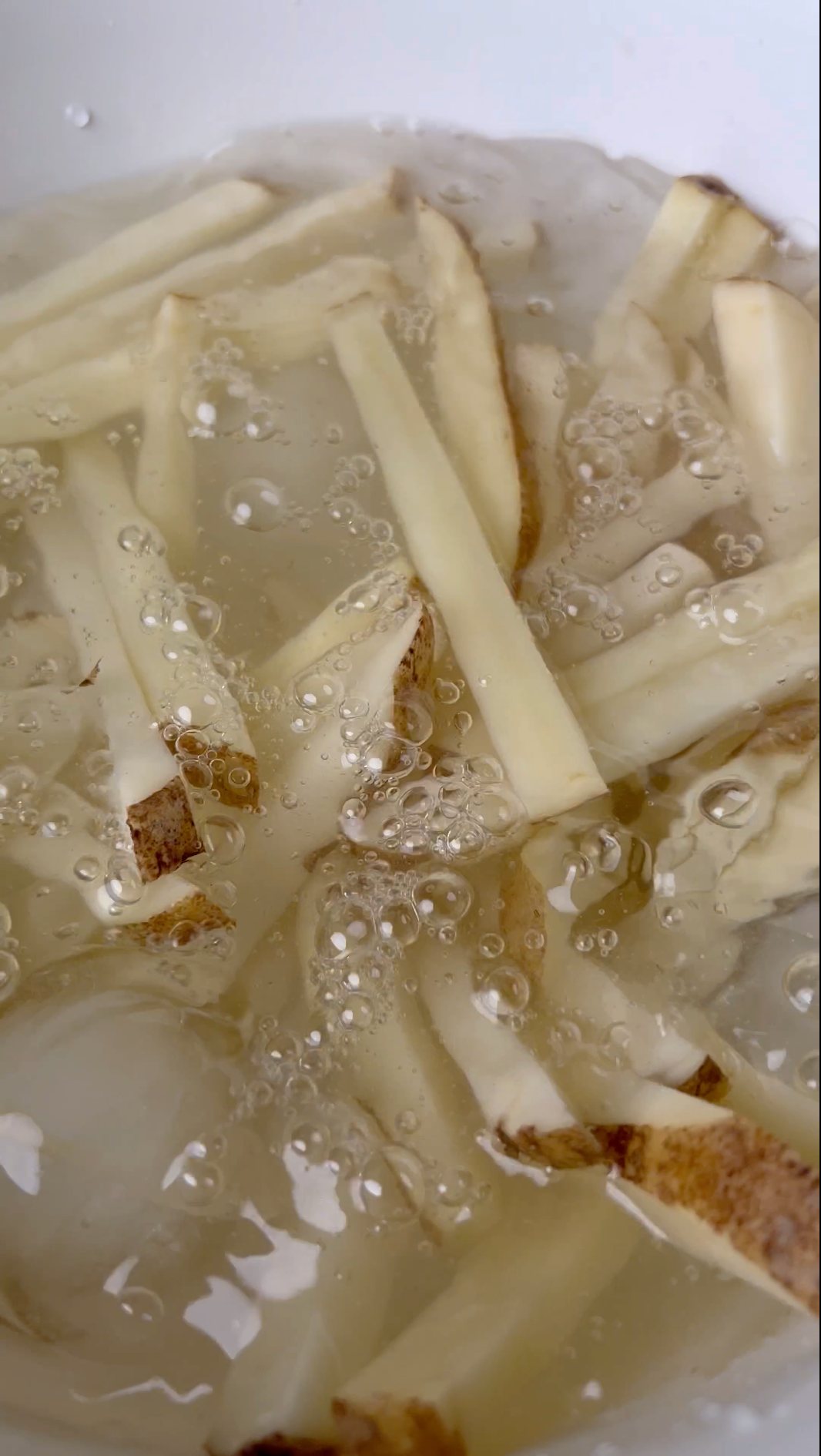 Soaking cut and peeled fries in ice water removes starch and makes french fries more crispy