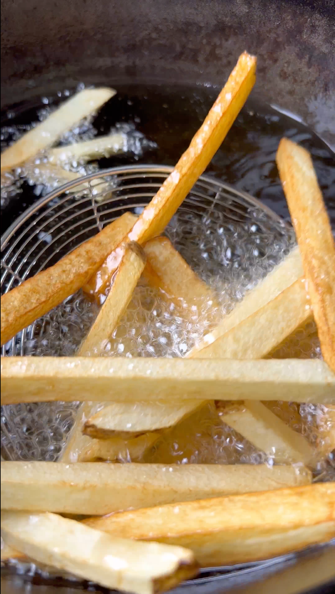 Deep fry homemade french fries in oil at 350 degrees until crisp and brown