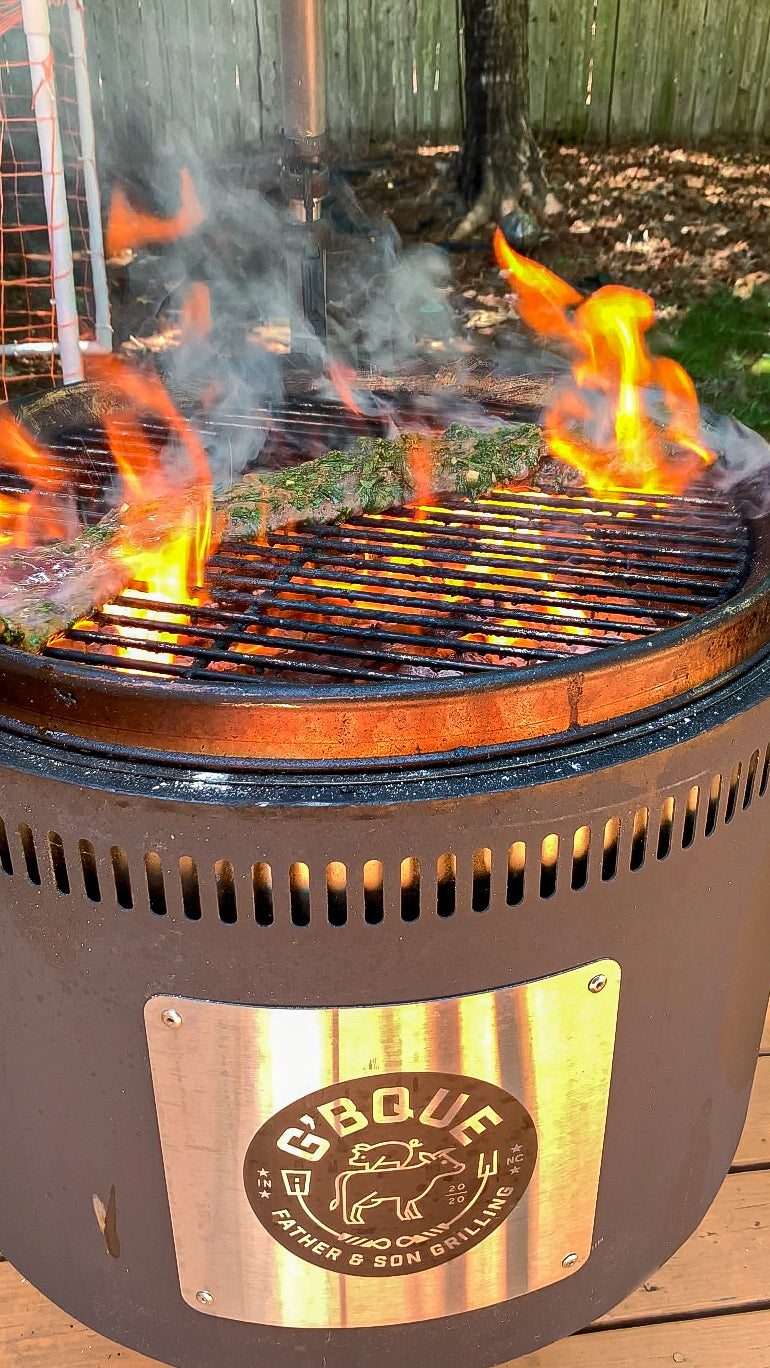 Searing a skirt steak over high heat direct flame on a Burch Barrel charcoal live fire grill