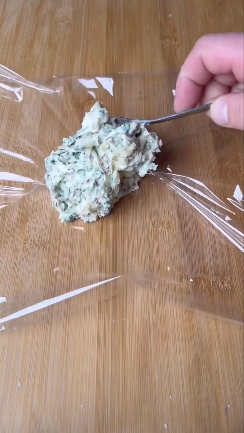 Wrap compound butter in plastic wrap to create a stick or log of butter