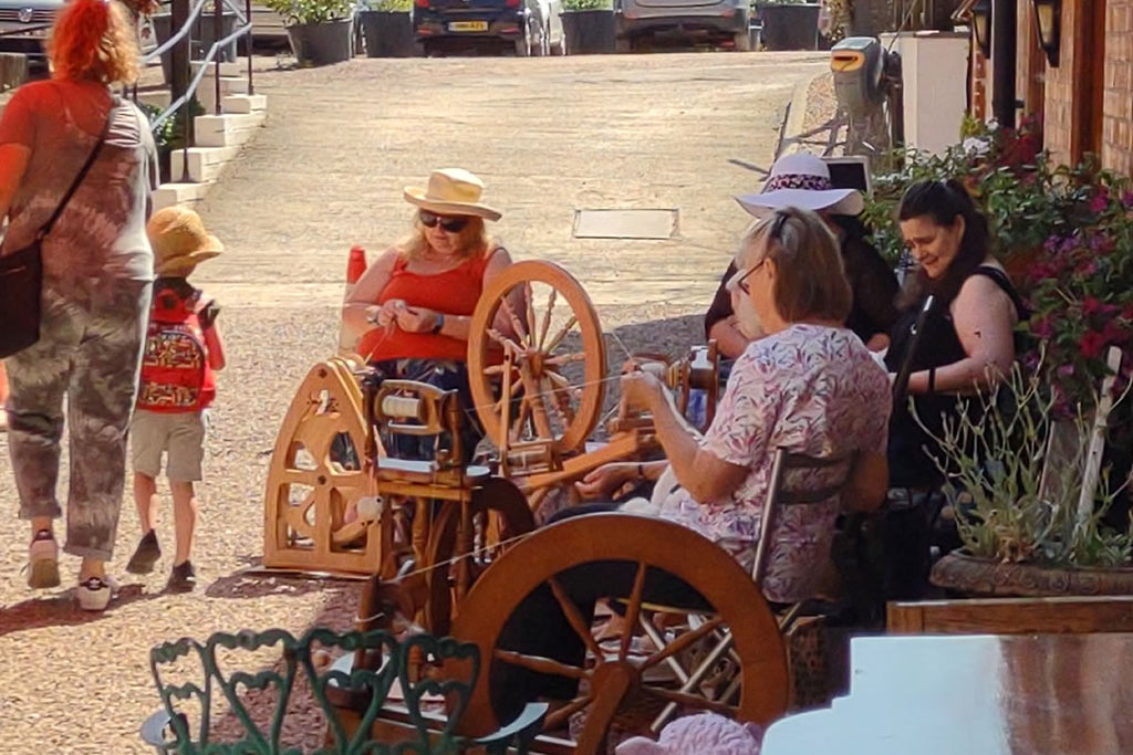 spinning wool yarn on a spinning wheel at fibrehut